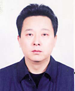 刘汉希望小学捐赠者:我们只是老实盖楼(图)